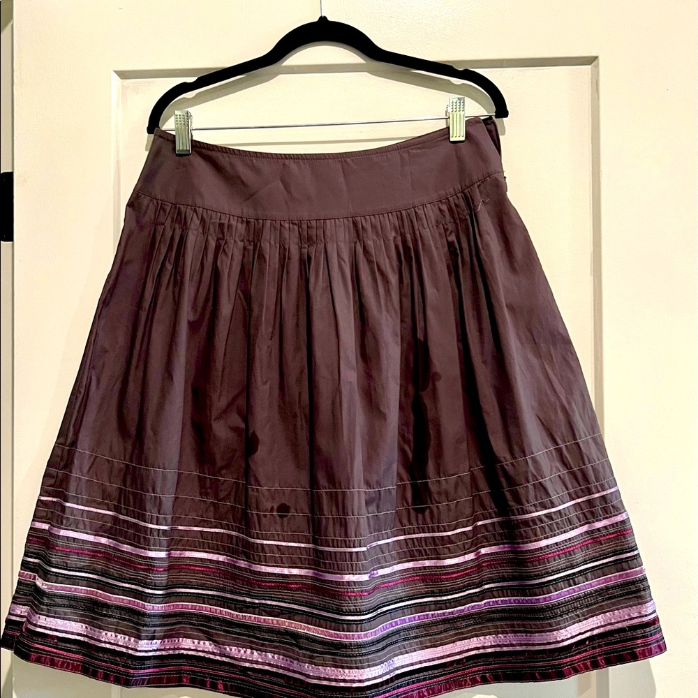 Plum colored skirt.
